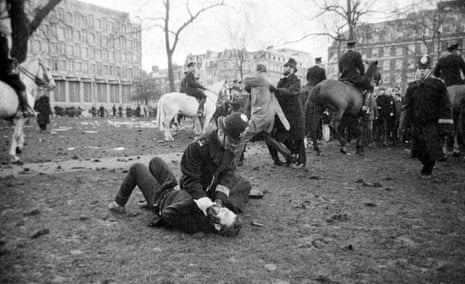 A policeman pins down an anti-Vietnam war demonstrator during riots at the US embassy in Grosvenor Square, London, in March 1968