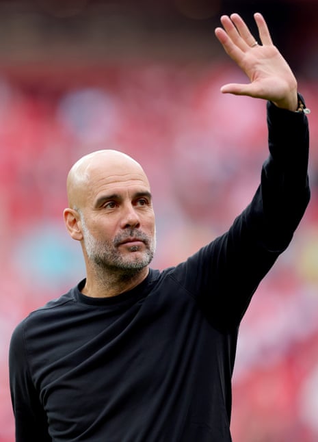 Pep Guardiola waving to fans