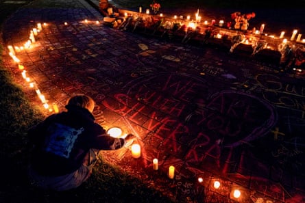 a woman lighting a candle