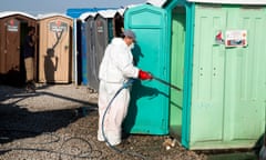 Teri Pengilley for The Guardian
The toilets are cleaned whilst a migrant cleans his teeth in the over-crowded Calais refugee camp. 
A concerted effort has seen the camp become significantly cleaner, with fewer rats.