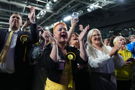 SNP supporters cheering after their win in Glasgow Easterhouse and Springburn.