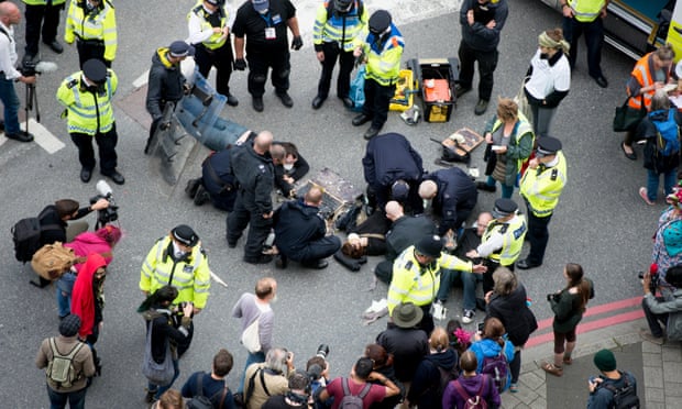 Activists protest against the Defence and Security Equipment international arms fair at the Excel centre in London.