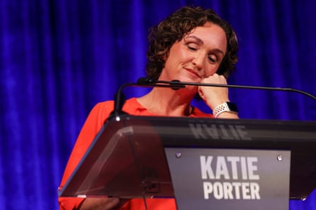Woman on stage behind lectern
