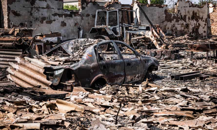 A burnt car and tractor after shelling by Russian forces in the town of Orikhiv, near Zaporizhzhia, eastern Ukraine.