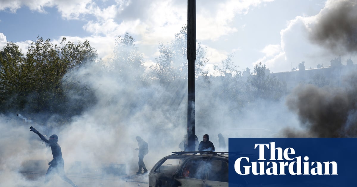 Buildings set ablaze and more than 1,200 arrested as police clash with protesters across France
