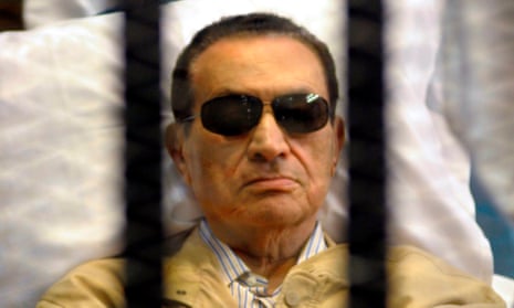 Hosni Mubarak in a cage in court during his trial in Cairo in 2012