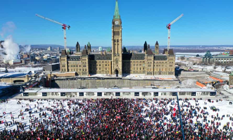 A crowd of protesters gather in front of Parliament Hill, in Ottawa, Canada on Saturday.