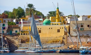 Feluccas, traditional wooden sailing boats, on the Nile at Aswan.