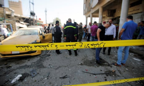 A police cordon at the site of a car bomb attack near a government office in Baghdad, Iraq, on Monday