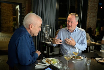 Carey and Chris discuss with vigour over their food.