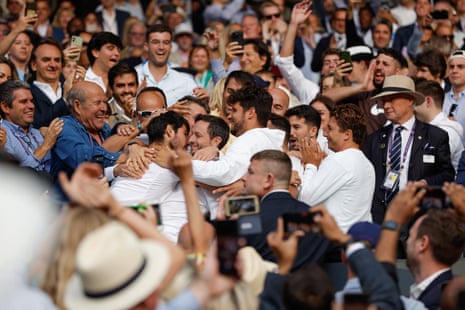 Carlos Alcaraz celebrates with his team after defeating Novak Djokovic in the final