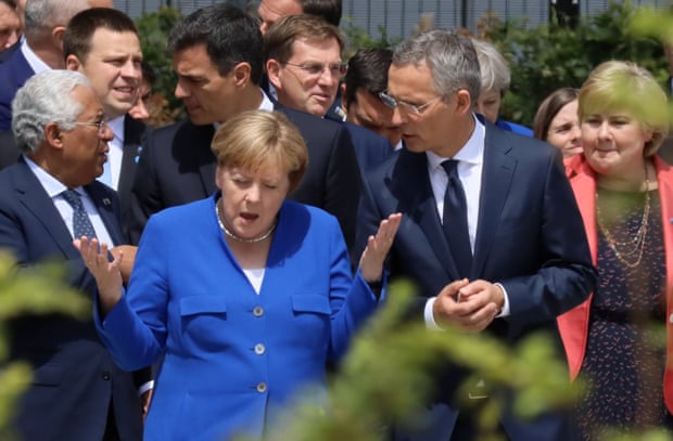 Germany’s chancellor, Angela Merkel, and Nato secretary general Jens Stoltenberg speak at the start of the summit in Brussels.