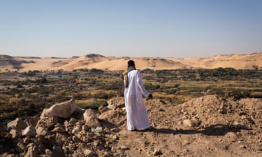 A Nubian, Khalid Ashraf, looks out over the cataracts above Aswan in Egypt