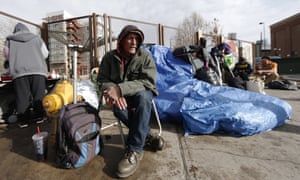 Salvatore Garofalo sits in a lawn chair in a makeshift homeless camp across from the Denver Rescue Mission in downtown Denver on Monday, the day before city workers started dismantling makeshift shelters.