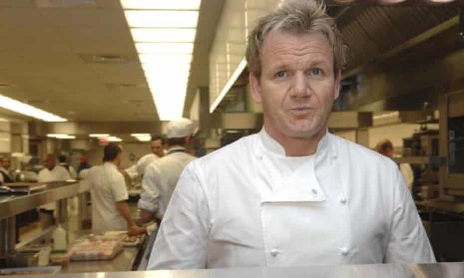 Gordon Ramsay poses in a kitchen