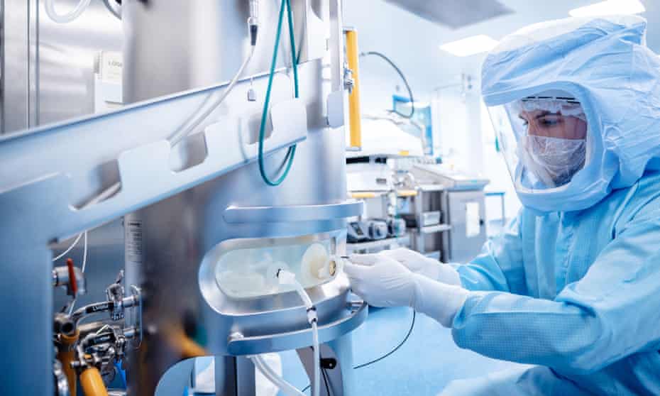An employee at the German pharmaceuticals company BioNTech works in a facility for mRNA production in Marburg, Germany.