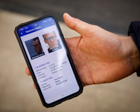 An image of a headshot of Guardian reporter Robert Booth on his smartphone as he gets added to the Met’s system and is spotted by its cameras.