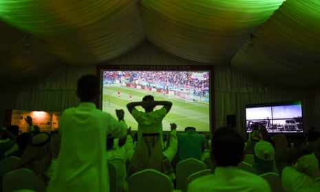Saudi football fans watch their national team during a  Russia 2018 World Cup match against at a fan tent in Riyadh.