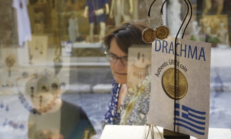 Tourists look at a display of jewellery made from old drachma coins in Athens. The government is still insisting that a return to the old currency is not being contemplated.