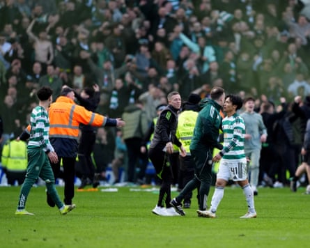 Celtic’s victory was marred by ugly scenes after fans spilled on to the Ibrox pitch.