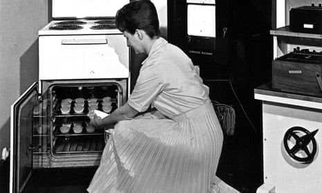 A 1960s promotional photograph of a woman using a Belling oven.