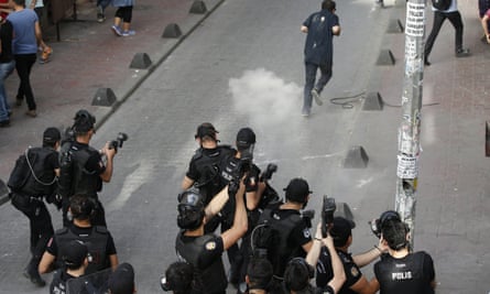Turkish police officers fire teargas and rubber bullets to disperse demonstrators who gathered for a gay pride rally in Istanbul.