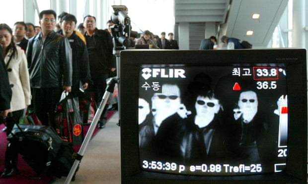 A thermal camera monitors the body temperature of passengers arriving in Seoul from Taipei to check for Sars
