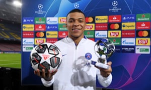 Kylian Mbappe of Paris Saint-Germain poses for a photo with the match ball and the man of the match award.