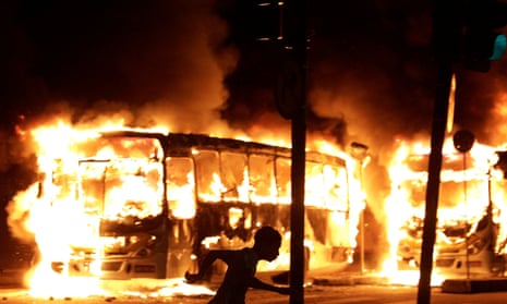 Buses burn during clashes in Rio de Janeiro.