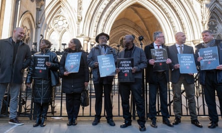 The Peterkin and Mehmet families outside the Royal Courts of Justice in London