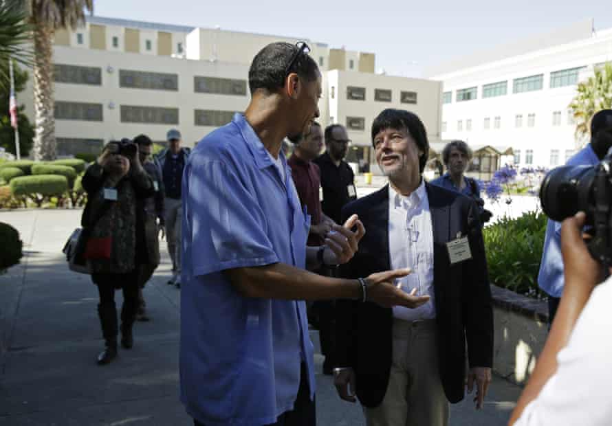 Filmmaker Ken Burns walks with Thomas at San Quentin State Prison in California.