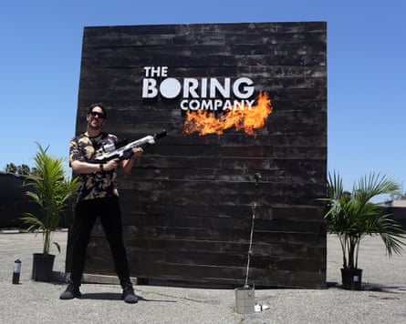 A man holds a flame-thrower.