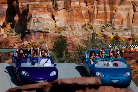 Visitors ride on the Radiator Springs Racers inside Disneyland, in Anaheim, California.