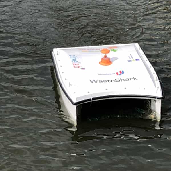 A small catamaran-shaped drone that moves across the surface of a canal