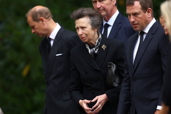 Princess Anne views tributes with Edward, Earl of Wessex; Timothy Laurence, Peter Phillips and Zara Tindall.