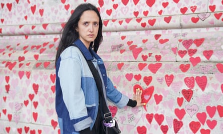 Safia Ngah, who lost her father, Zahri, to the coronavirus, painted a heart for him on the National Covid Memorial wall in central London.
