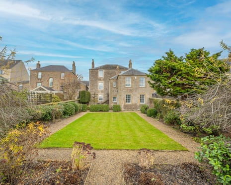 Large rectangular lawn and house in Kelso in the background