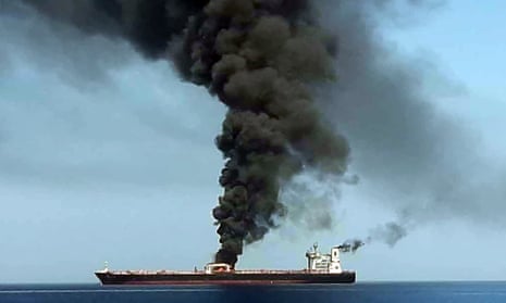 A grab from Iranian state TV that it says shows smoke billowing from one of two tankers that sent out distress calls in the Gulf of Oman on Thursday.