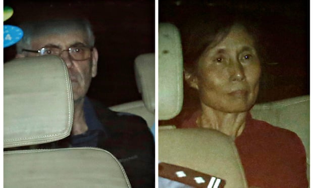 Peter Humphrey (L) and his wife Yu Yingzeng as they leave court in August 2014.