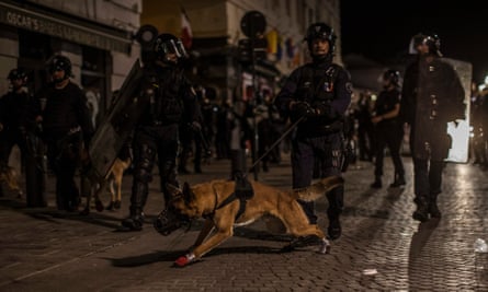 French riot police patrol the streets of Marseille on Saturday night.