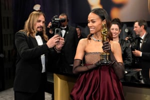 Marco Perego-Saldana, takes a photo of Zoe Saldana at the Governors Ball