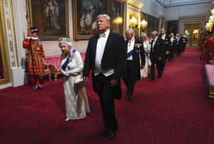 2019: Queen Elizabeth II and Donald Trump arrive in front of guests through the east gallery before the state banquet at Buckingham Palace