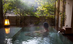 Bathing in Kawayu Onsen.