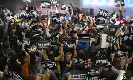 Fetterman's supporters, many of them young, celebrate with signs on election night