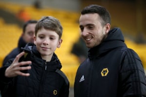 Wolverhampton Wanderers’s Diogo Jota poses for a photo with a fan.