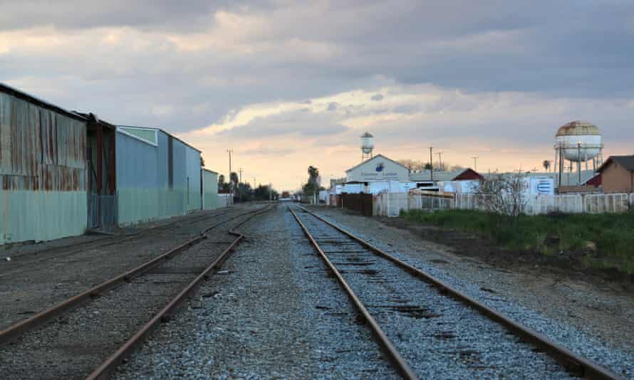 Train tracks in the rural California town of Patterson, which today are lined by small homeless encampments.