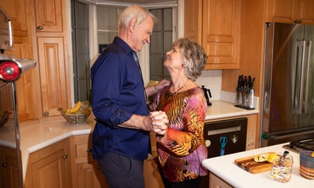 Relationship experts Gay and Katie Hendricks dancing together at home