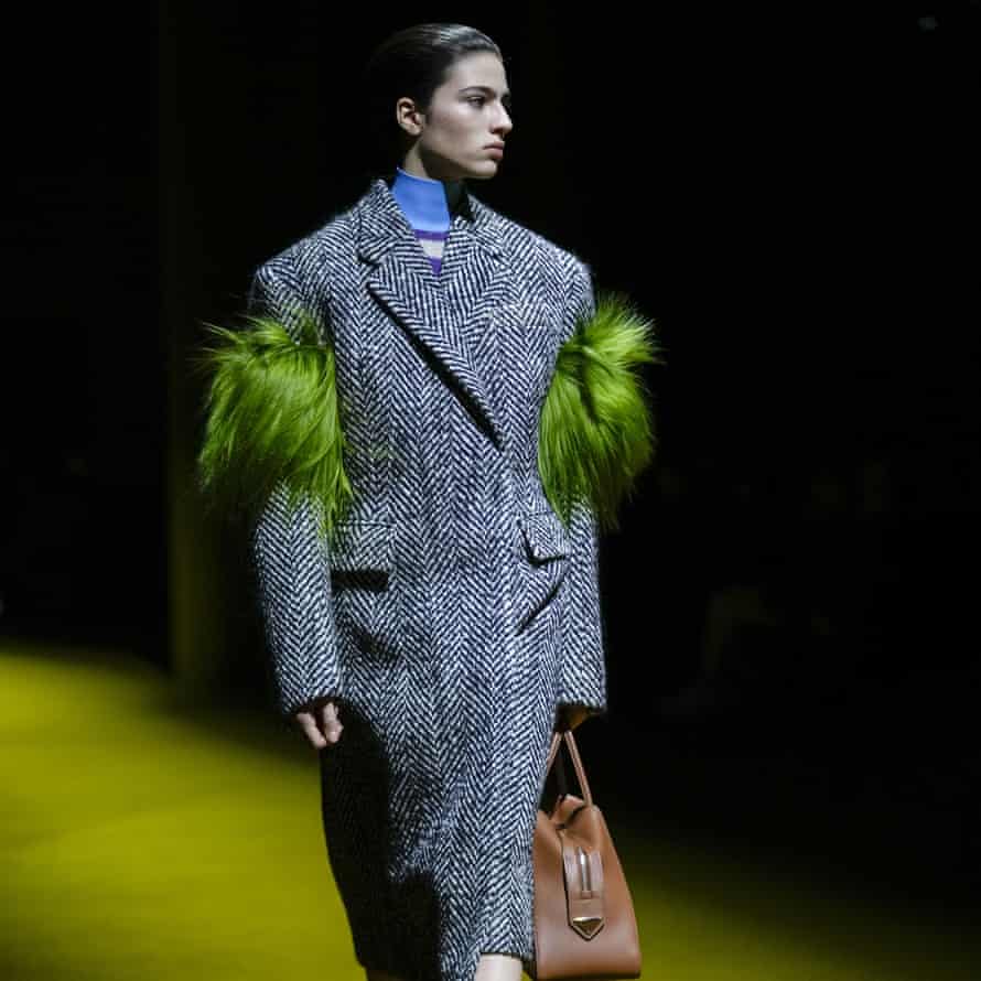 Tailored coat with pastel feathers.