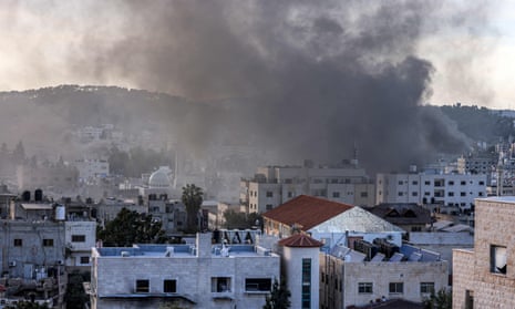 Smoke rises from the Jenin camp in the occupied West Bank on Tuesday. 