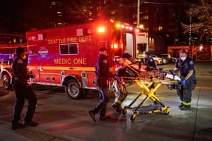 Seattle Fire Department medics transport a stabbing victim